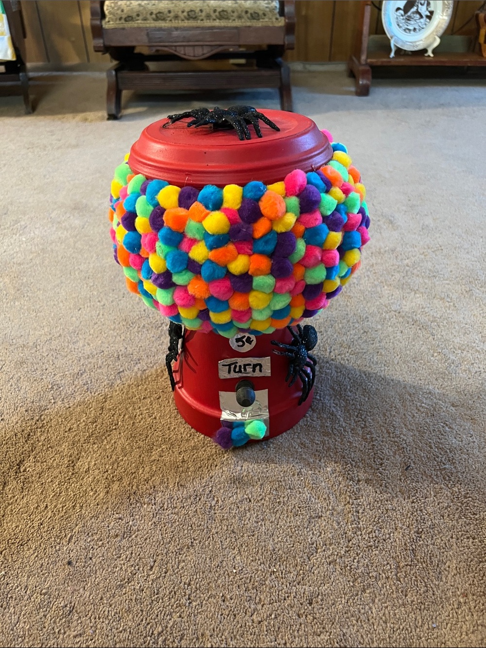 Red Gumball Toy Machine with Multicolor Pom-Pom Cover with Spiders